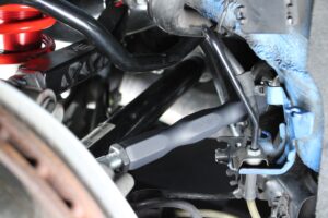 Meisterschaft Motorsport Engineering Rear Camber Arms 14-16mm - Toyota A90 Supra / BMW Z4 G29 (2019-2026) 9 A90 Supra rear camber arm and red rod end installed at the knuckle